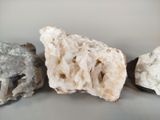 three different types of rocks on a table