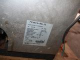 a label on the back of a machine that is sitting on a table