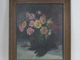 un tableau de fleurs dans un vase sur le mur