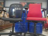two chairs that are sitting on top of blue drums
