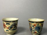 pair of chinese blue and white porcelain cups with dragon design