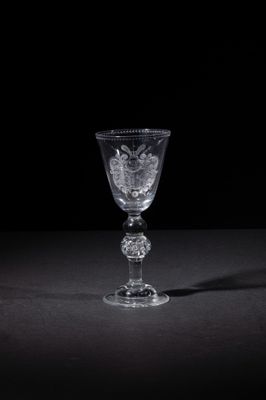 a wine glass that is sitting on a table