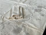 three napkins on a table with a white table cloth