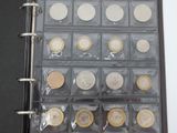 a picture of a binder with a lot of coins in it