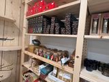 a pantry with a lot of food on the shelves