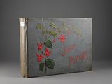 an old book with a picture of a flower on it
