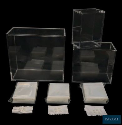 three clear boxes that are sitting next to each other