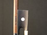 a knife that is next to a pencil on a table