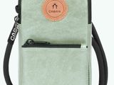 a small green bag with a leather label on it