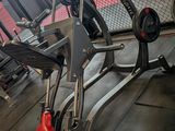 a gym room with a bench, weights, and other equipment
