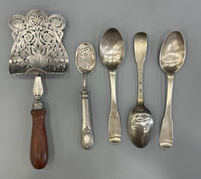 five spoons, a ladle, and a ladle on a table