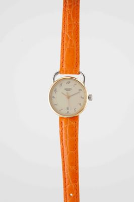 a close up of a wrist watch on a white background