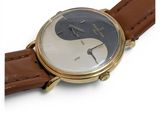 a close up of a wrist watch with a yin sign on it