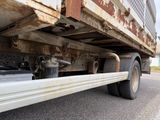 a close up of a truck ' s rear end on the road