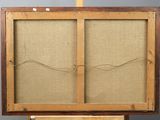 an old wooden easel with a piece of fabric on top of it