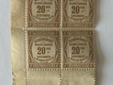 four old postage stamps are on a piece of paper