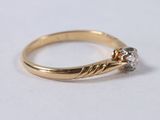 an image of a diamond ring on a white surface