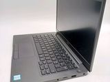 a laptop that is sitting on a white table