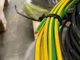 a bunch of yellow and green wires on a table