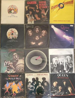 a lot of different album covers on the wall