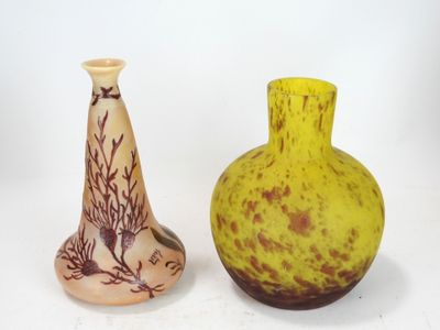 two vases sitting next to each other on a white surface