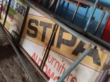 a lot of signs that are on the side of a building