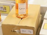 several boxes of wine are stacked on top of each other on a pallet