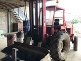 a forklift that is parked in a garage