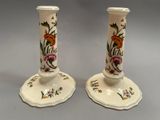 pair of hand painted porcelain candlesticks with flowers and leaves