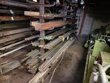 several pieces of wood are stacked on a rack in a warehouse