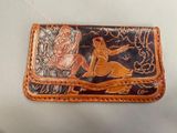 leather wallet with a picture of a man riding a horse