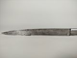 a knife that is sitting on a table