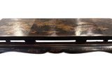 une photo d'une table basse noire avec un plateau en marbre