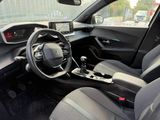 the interior of a car with a steering wheel, dashboard, and dashboard controls
