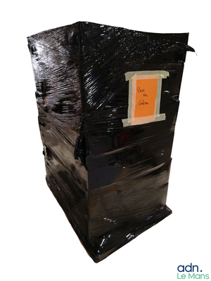 a picture of a black trash can with a sticker on it