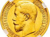 a close up of a gold coin on a white background