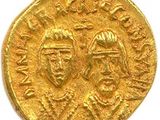 une pièce d'or sur laquelle figurent les portraits d'un homme et d'une femme