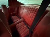 a red leather seat in the back of a car