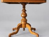 a small table with a wooden top and a wooden base