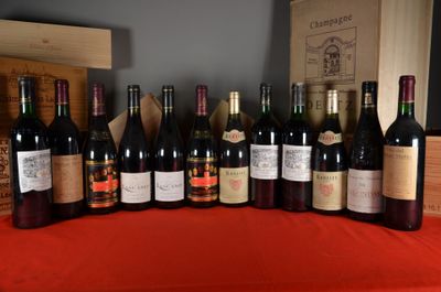 bottles of wine are lined up on a table with a red table cloth