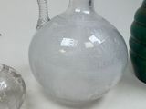 three vases that are sitting next to each other on a table