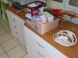 a desk with a printer and a printer on top of it