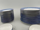 a lot of plates that are sitting on a table