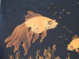two goldfishs swimming in a pond of water