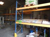 a large warehouse with a lot of shelves and pallets