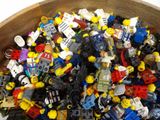 a bowl full of legos sitting on a table