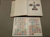 a book with stamps on it sitting on a table