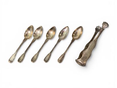 six spoons and a spoon rest in a row on a white surface