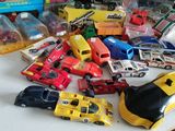 a lot of toy cars that are on the table