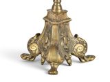 a gold table with a glass top on a white background
